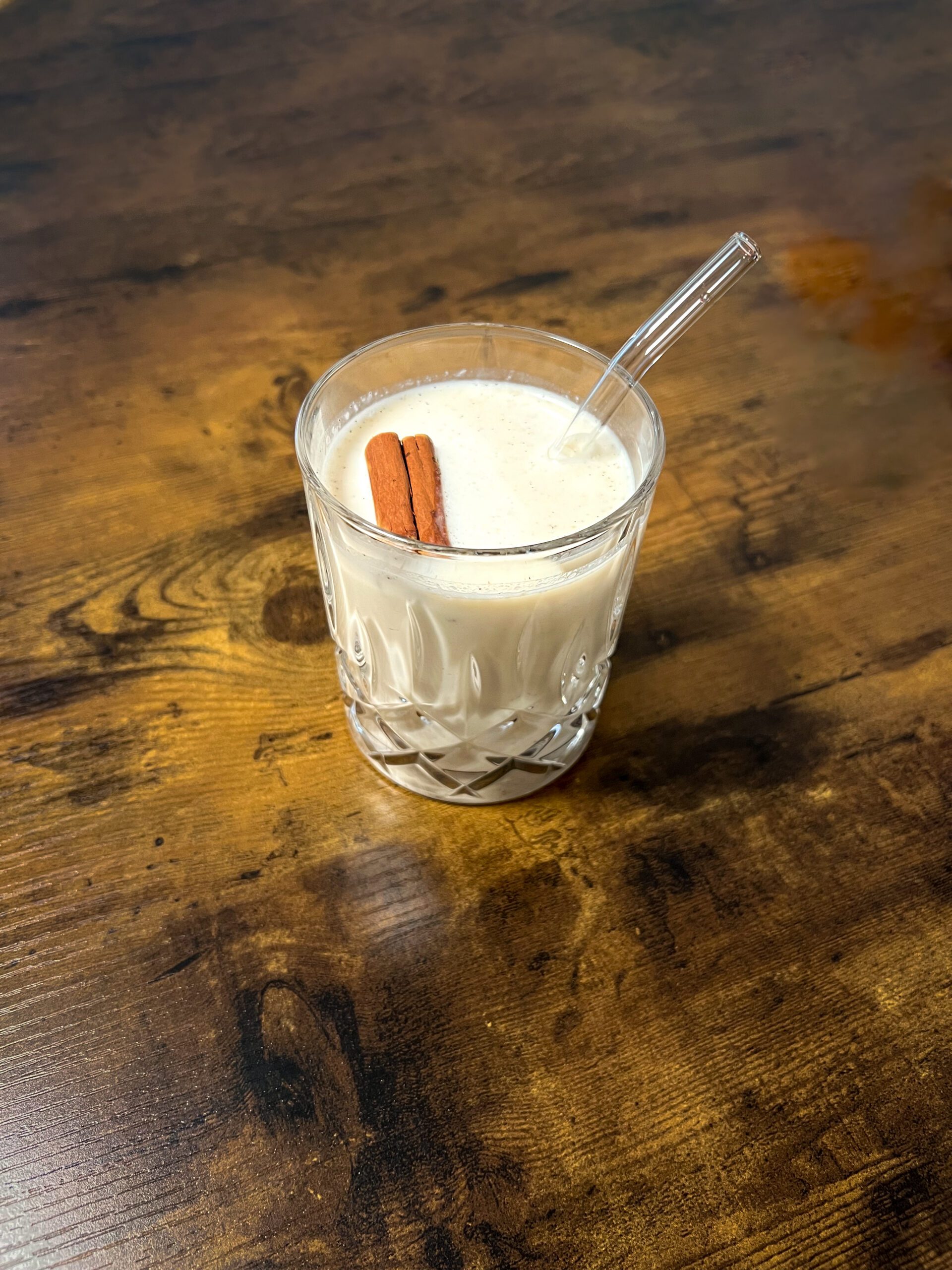 easy homemade horchata with a cinnamon stick on a wooden table