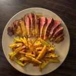 Steak with Potato Fries and Pepper Sauce