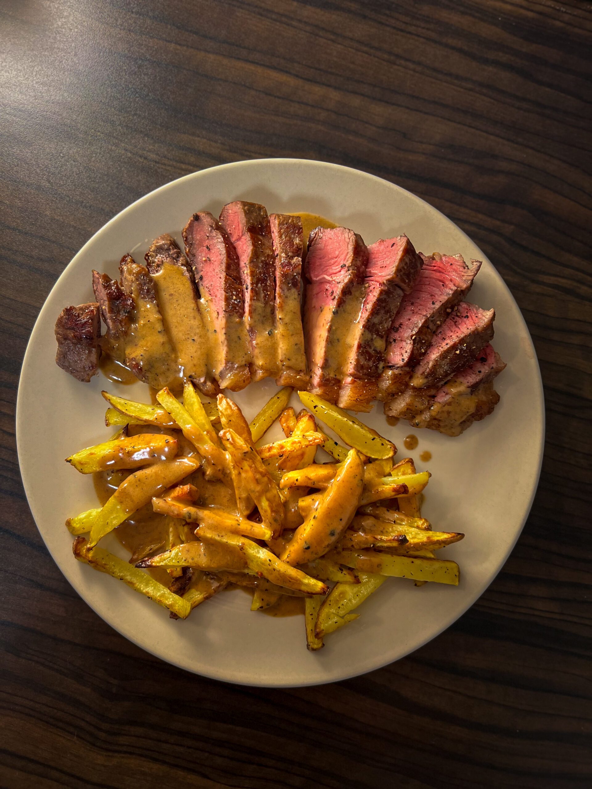 Steak with Potato Fries and Pepper Sauce